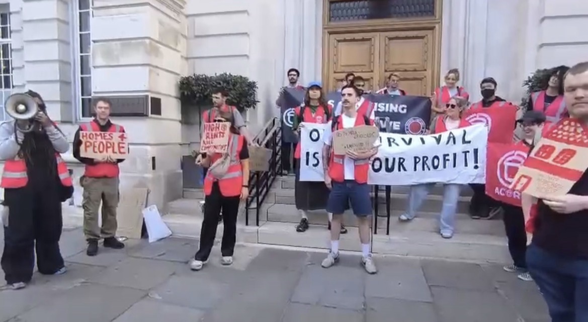Alicia Samuels speaking on a megaphone during an ACORN national day of action